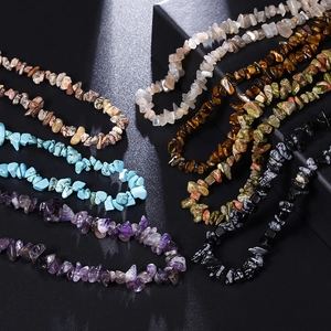 Macro detail of various natural crushed stone and shell necklaces with polished textures