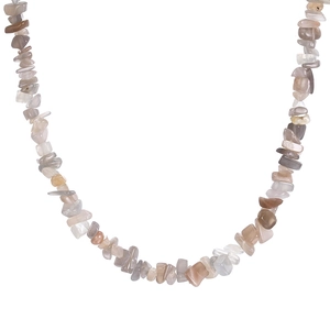 Macro shot of natural crushed shell necklace featuring irregular milky white and grey stones