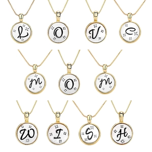 Double-layered gold and silver letter necklace set with sparkling zircon stones