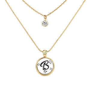 Macro shot of double-layer gold necklace featuring letter B pendant and crystal accents
