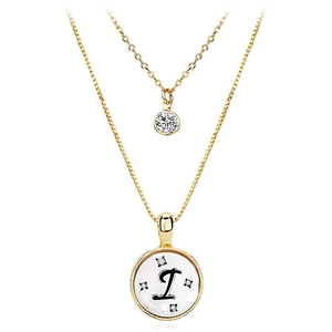 Close-up of a double-layered gold necklace featuring a letter I pendant and zircons