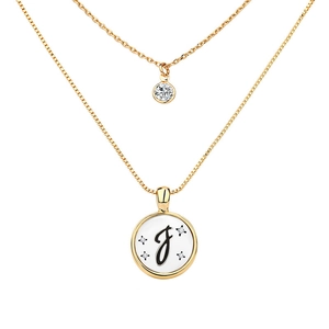Detail of double-layer gold necklace with letter J pendant and sparkling zircon stones