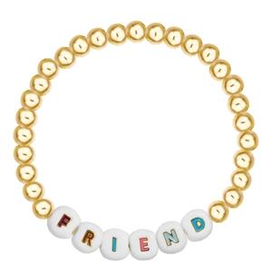 Close-up of golden beaded friendship bracelet with colorful FRIEND letter beads