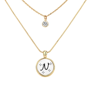 Detail of double-layer gold necklace featuring letter N pendant and sparkling zircon stone