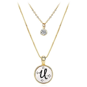 Detail of double-layer gold letter U necklace with round zircon and coin pendant