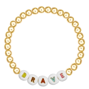Detailed close-up of a gold beaded bracelet with colorful letter beads spelling BRAVE