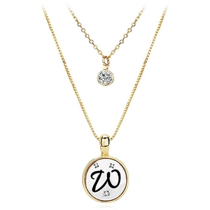 Detail of double-layer gold necklace featuring a letter W pendant and round zircon stone