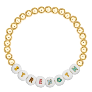 Detail of gold beaded bracelet with letter charms spelling STRENGTH for motivation
