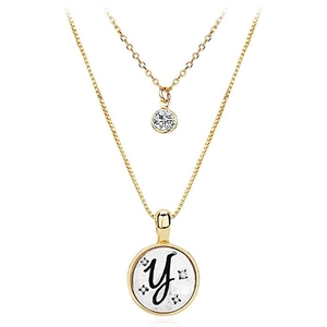 Close-up of double layer gold necklace featuring letter Y pendant with zircon stones