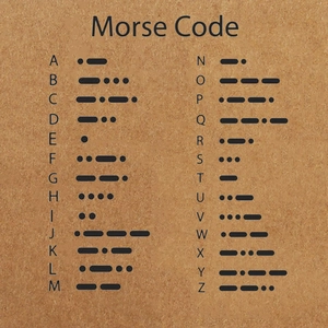 Morse code alphabet chart on cork background for couples bracelets reference