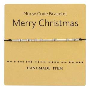 Handmade Morse code bracelet with silver beads on a festive Merry Christmas gift card
