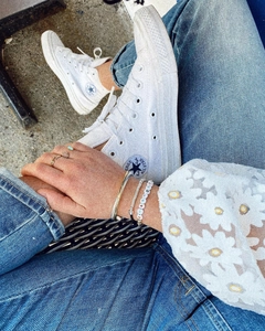 Bohemian multilayered bracelet and ring set with turquoise stone on casual outfit