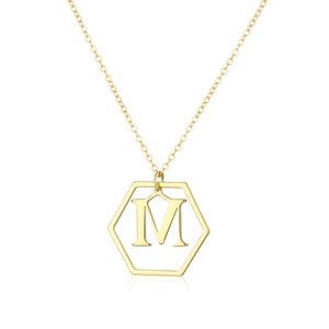Macro shot of gold-plated hexagonal pendant featuring the letter M on a fine O-chain