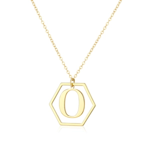 Detailed macro view of the gold-colored polished hexagonal pendant with an engraved letter O
