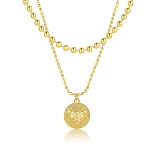 Collana a doppio strato dorata con perline e un ciondolo circolare con rilievo d'ape