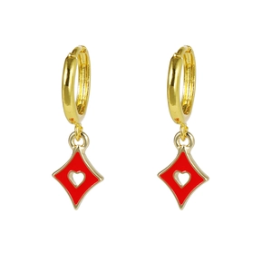 Close-up of gold dangle earrings with red diamond-shaped heart charms in oil-drop style