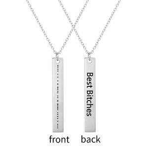 Detail of silver bar necklace showing Morse code and Best Bitches engraving