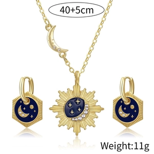 Star and moon gold jewelry set with blue enamel sun pendant and matching earrings