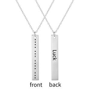 Morse code pendant necklace in stainless steel featuring engraved Luck text on the back