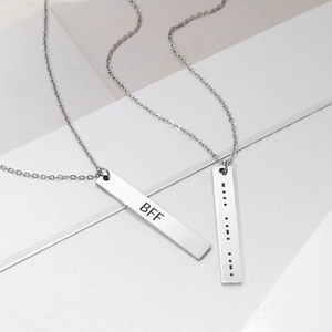 Detail of Morse code and BFF engraved rectangular silver bar pendants for best friends