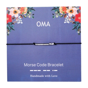 Detail of OMA Morse Code bracelet with silver beads on a purple floral display card