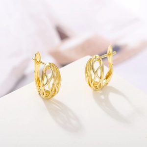 Minimalist gold-plated hollow vine pattern hoop earrings with an intricate woven design