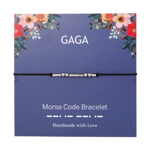 Detail of Morse code bracelet GAGA on purple floral card with silver beads and tubes