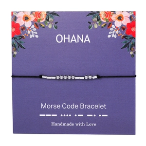 Detail of handmade Morse code bracelet with Ohana message on purple floral gift card