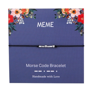 Detail showing Morse Code Bracelet with silver beads on floral blue display card