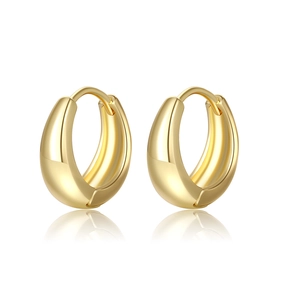 Detailed view of chunky gold hoop earrings with a high-polished mirror finish and teardrop shape