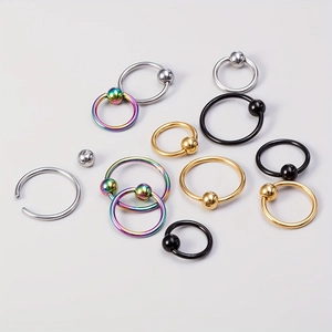Set of stainless steel captive bead rings in silver, gold, black, and rainbow colors