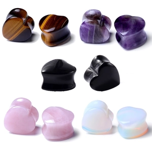 Heart-shaped stone ear plugs in tiger eye, amethyst, obsidian, rose quartz, and opalite