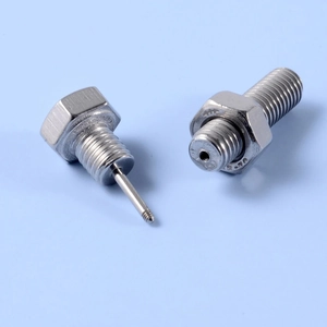 Detailed close-up of stainless steel screw stud earrings with punk rock nut design