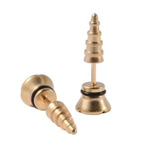 Macro view of gold stainless steel cone stud earrings with black rubber O-rings