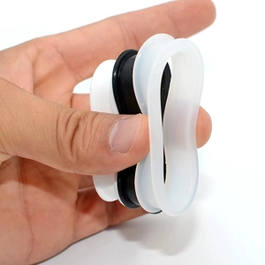 Flexible silicone double flare ear tunnels showing soft material and ultra-thin walls