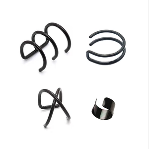 Detailed view of 4-piece black stainless steel non-piercing ear cuffs in various designs