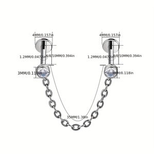 Detailed view of 16G 316L stainless steel lip stud with CZ stones and removable chain link