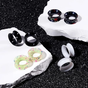 8-piece set of double flare silicone ear tunnels with black, white and splatter patterns