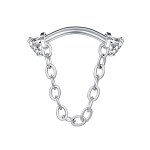 Detail of 16G stainless steel curved barbell featuring sparkling rhinestones and chain