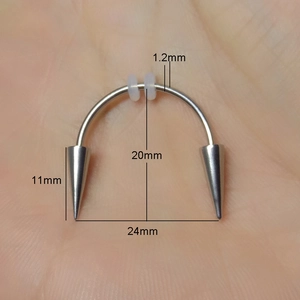 Detail showing 1.2mm surgical steel Dracula smile piercing with spikes and silicone rings