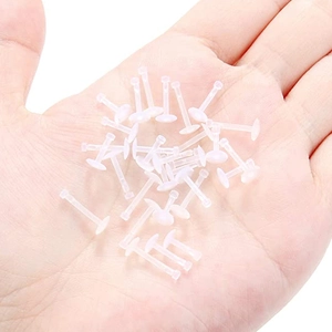 Lote de retenedores transparentes de acrílico UV para piercings de labio y oreja en palma