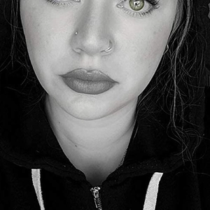 Polished stainless steel moon nose ring and stud set shown on female model nose wing
