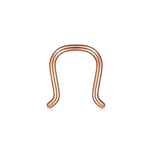 Close-up of polished rose gold U-shaped nose ring with smooth spherical ends