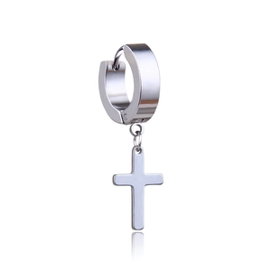 Macro shot of polished silver cross pendant earring with thick stainless steel hoop