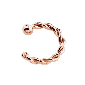 Detail of rose gold twisted C-ring piercing jewelry with smooth metal ball end