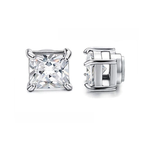 Close-up of square princess cut zircon earrings with four-prong silver setting detail