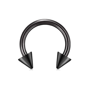 Close-up of black stainless steel horseshoe piercing with spiked ends on a white background