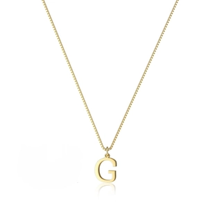Detailed macro view of a polished gold letter G pendant on a fine box chain necklace