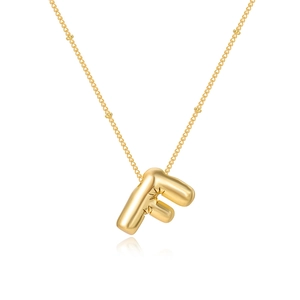 Detailed close-up of golden balloon-style letter F pendant with heart-shaped chain links