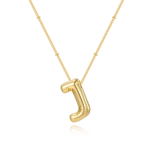 Detail of gold bubble letter J pendant with high-shine finish on beaded chain